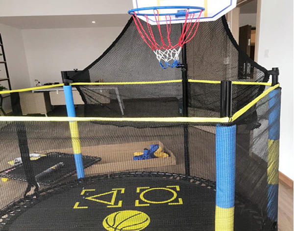 trampoline with basketball hoop and slide